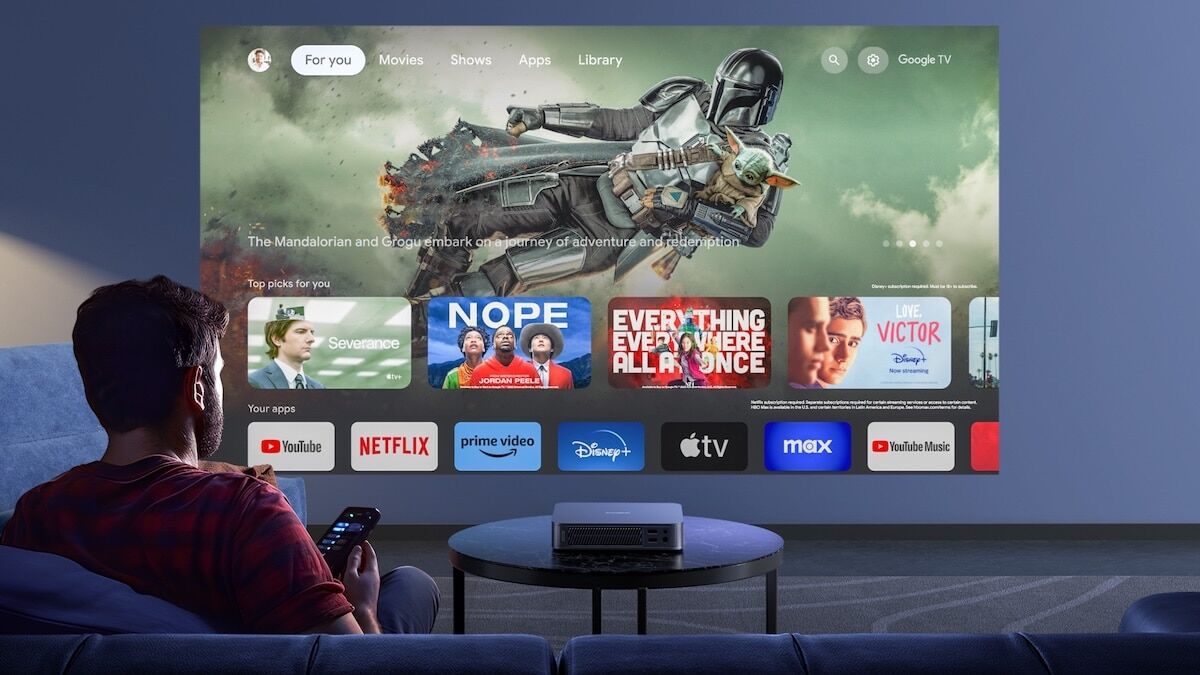 Man relaxing and watching television in 4K quality